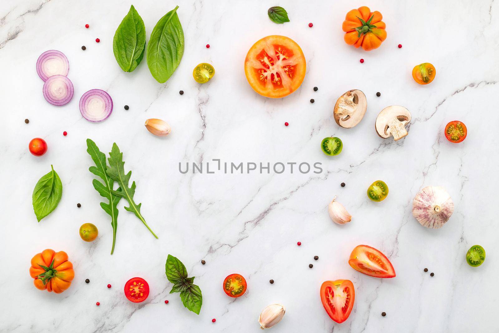 The ingredients for homemade pizza set up on white marble background. by kerdkanno