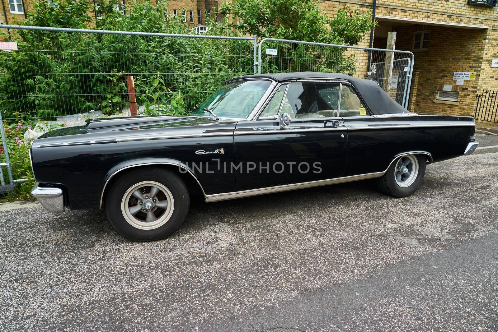 A black 2 door convertible 1965 Dodge Coronet 500