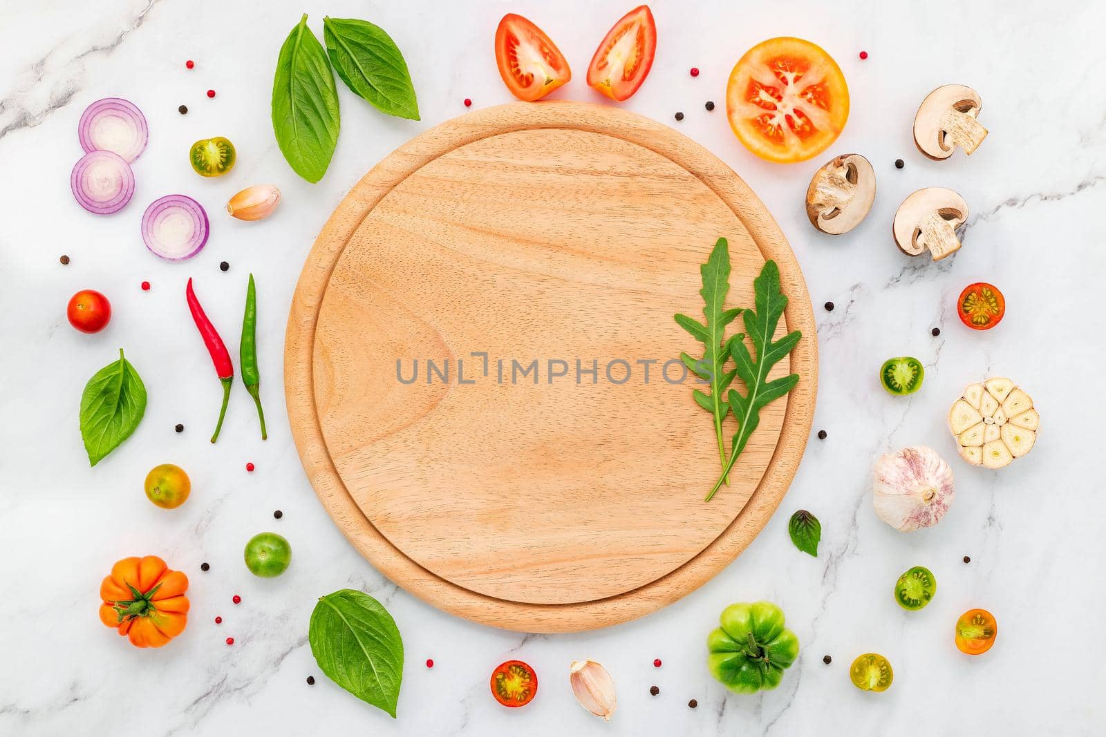 The ingredients for homemade pizza set up on white marble background. by kerdkanno