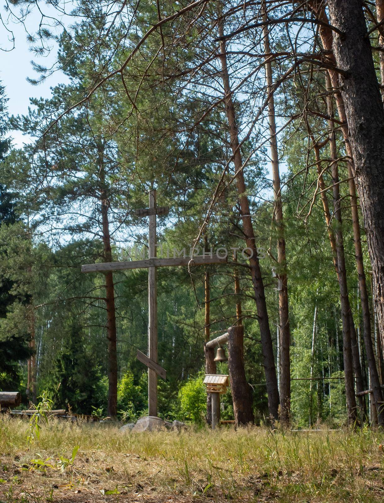 Memorial cross next to the Church of the Nativity of the Blessed Virgin Mary in the village of Kurilovo in the Moscow region. by fifg