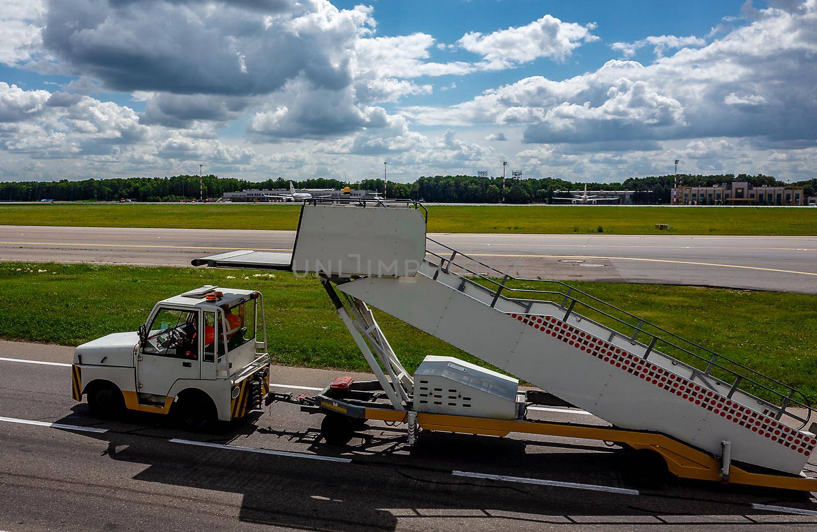July 2, 2019, Moscow, Russia. Peron transporter tows the ladder to the plane at Vnukovo International Airport.