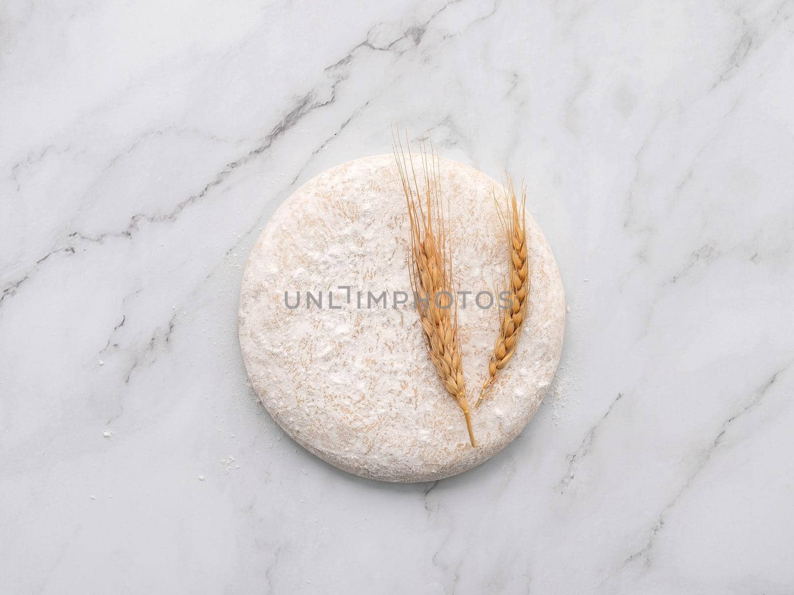Fresh homemade yeast dough resting on marble table flat lay. by kerdkanno