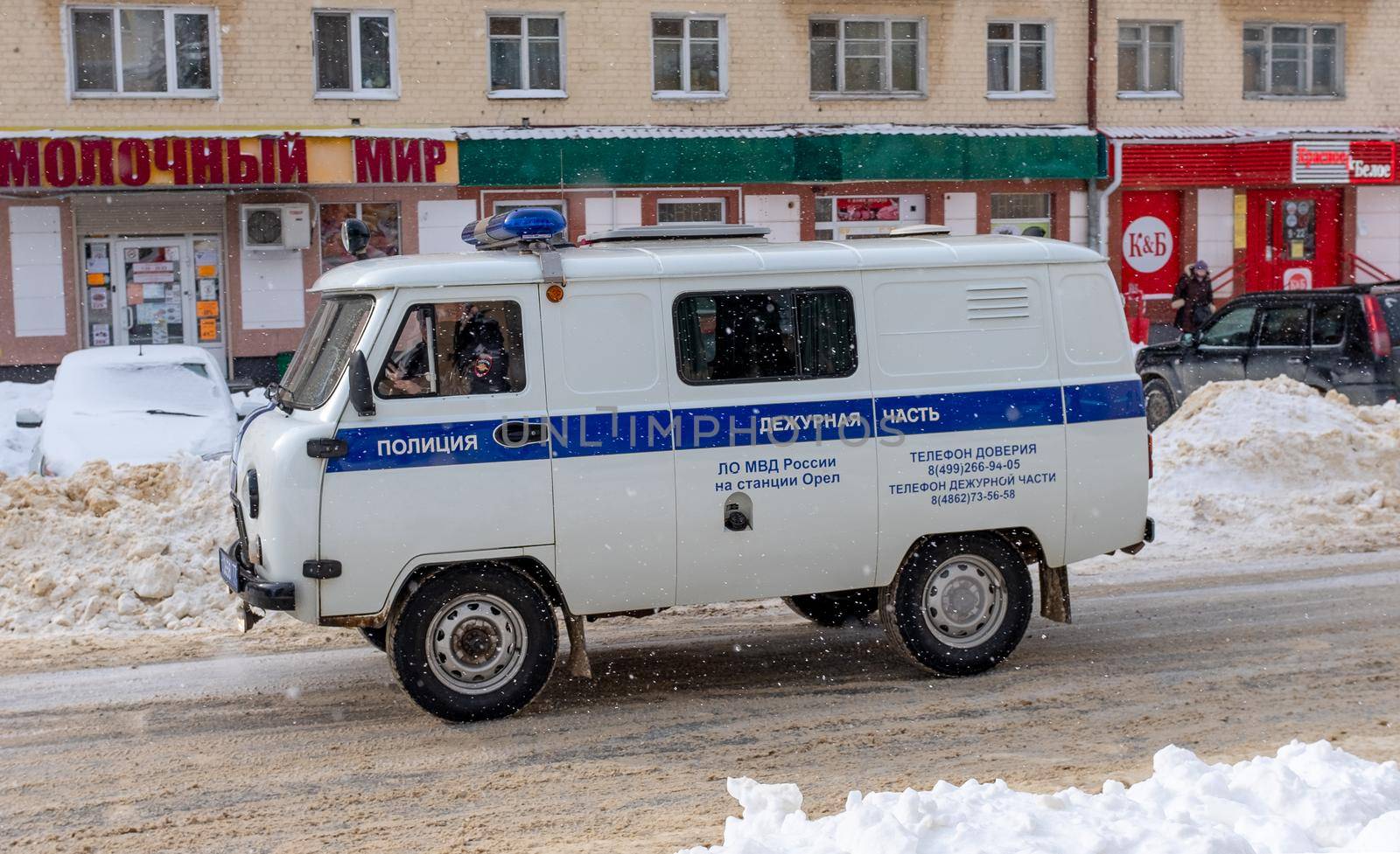 February 16, 2021, Orel, Russia. A UAZ 2206 police car on a street in Oryol during a snowfall.
