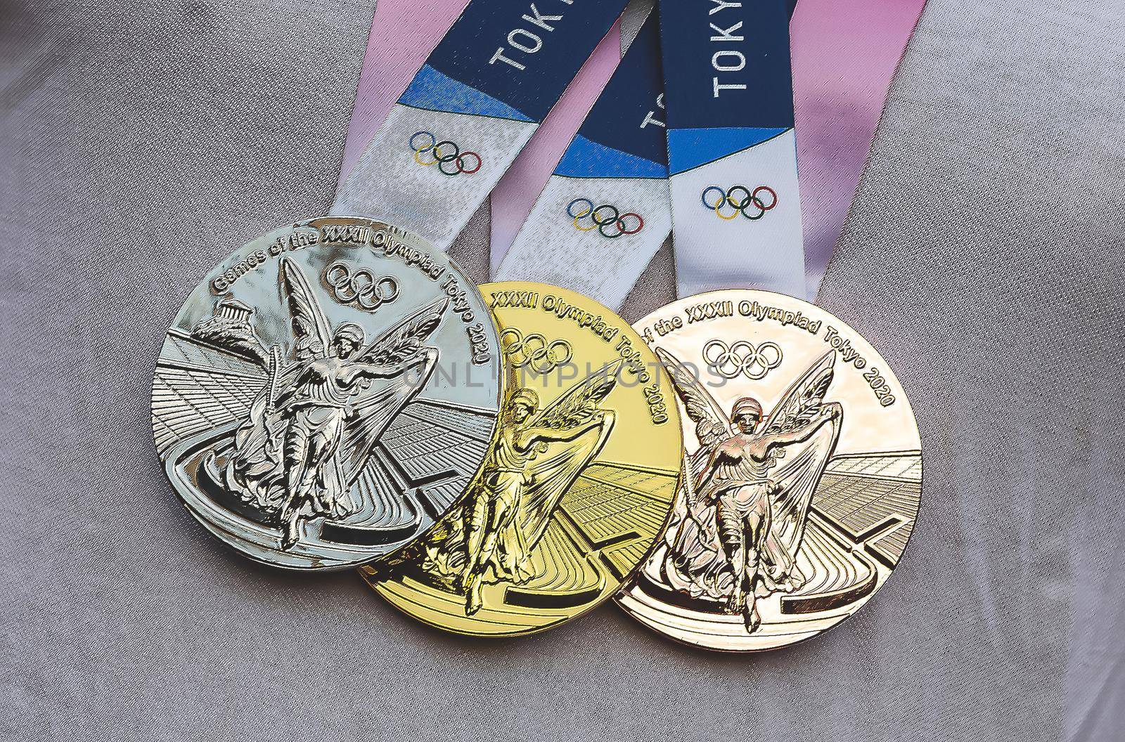 April 17, 2021 Tokyo, Japan. Gold, silver and bronze medals of the XXXII Summer Olympic Games in Tokyo on the chest of the athlete.