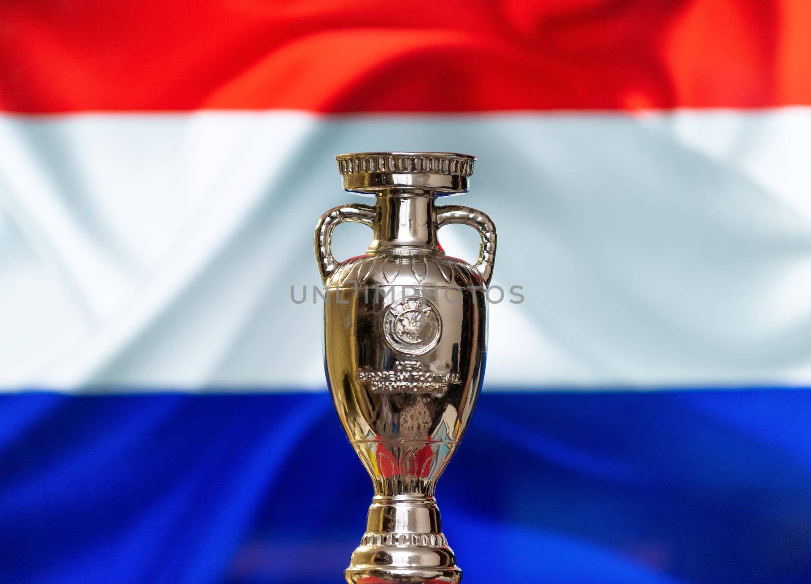 April 10, 2021. Amsterdam, Holland. UEFA European Championship Cup with the Netherlands flag in the background.