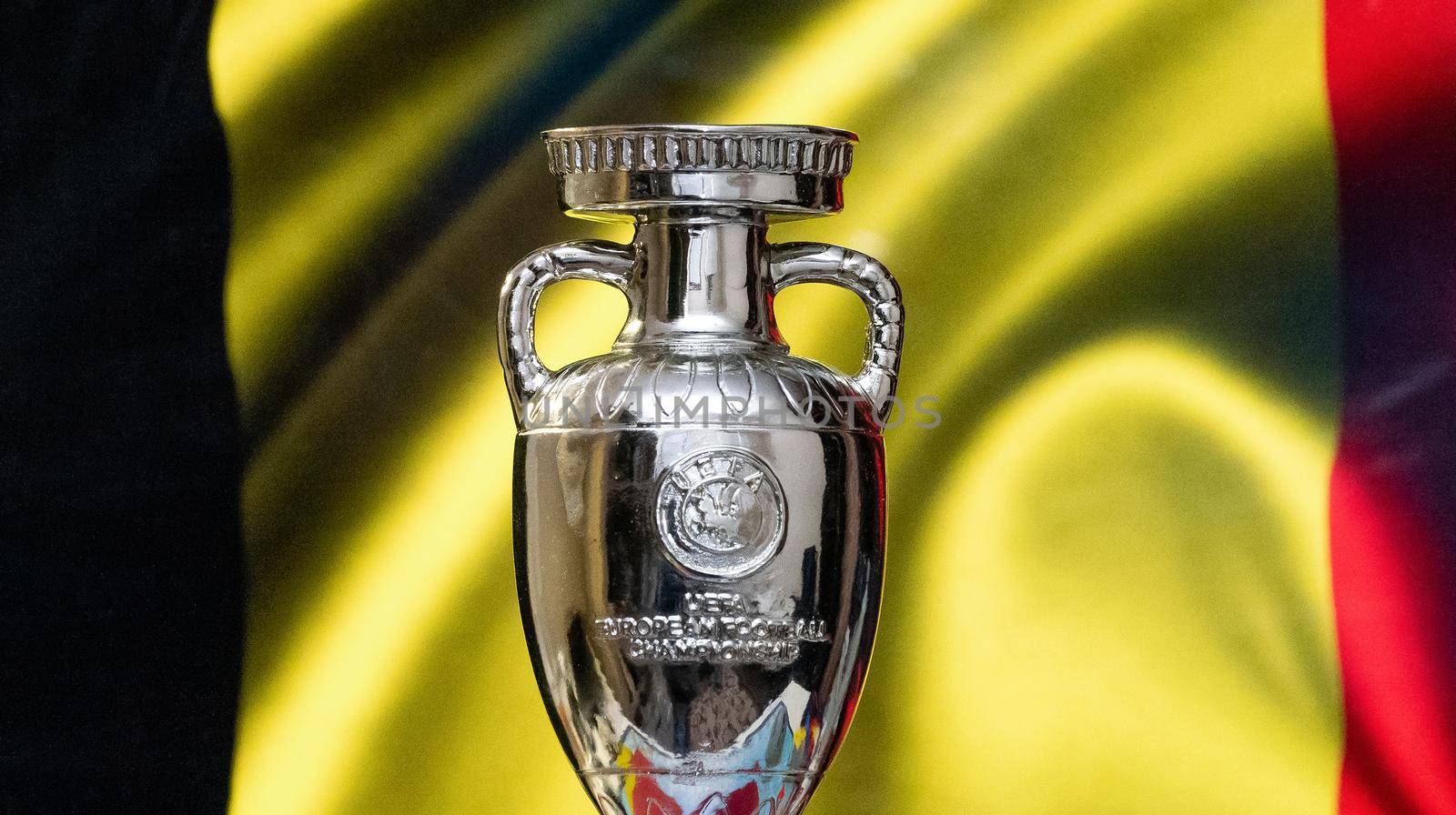 April 10, 2021. Brussels, Belgium. UEFA European Championship Cup with Belgium flag in the background.