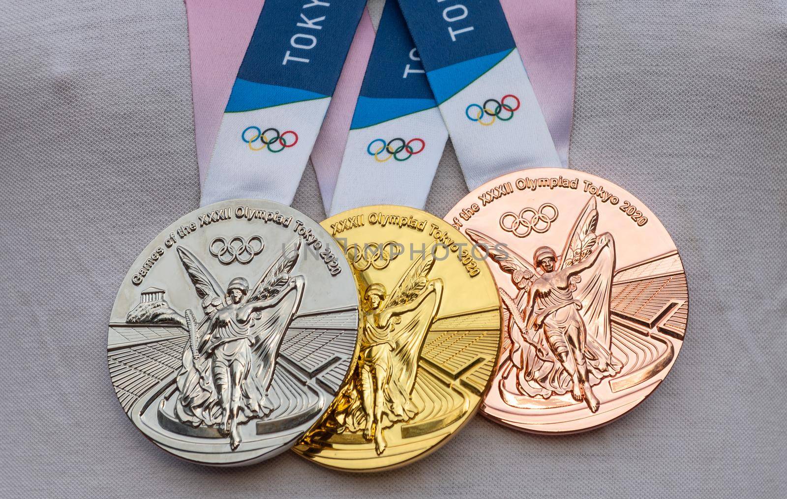 April 17, 2021 Tokyo, Japan. Gold, silver and bronze medals of the XXXII Summer Olympic Games in Tokyo on the chest of the athlete.