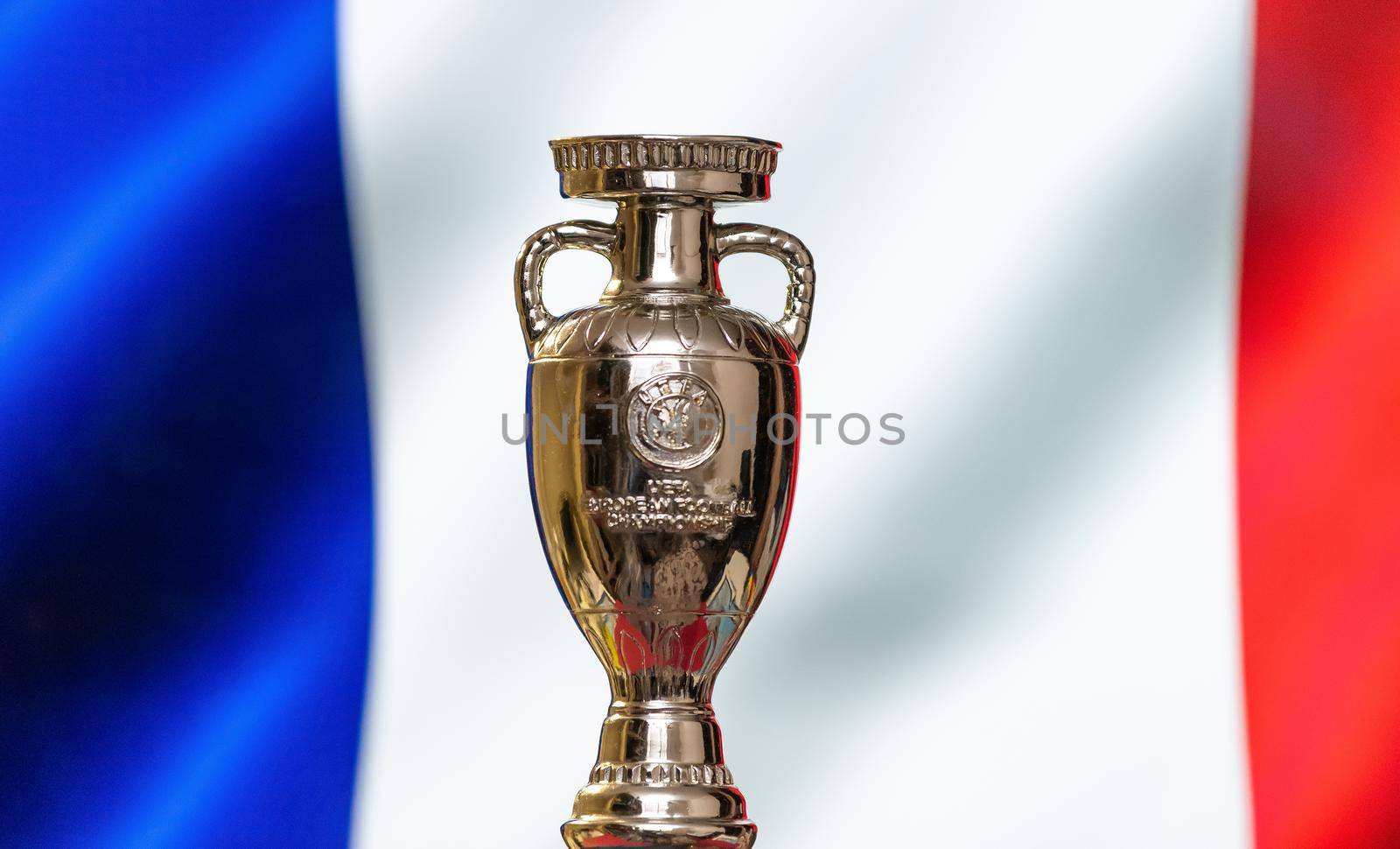 April 10, 2021. Paris, France. UEFA European Championship Cup with the French flag in the background.