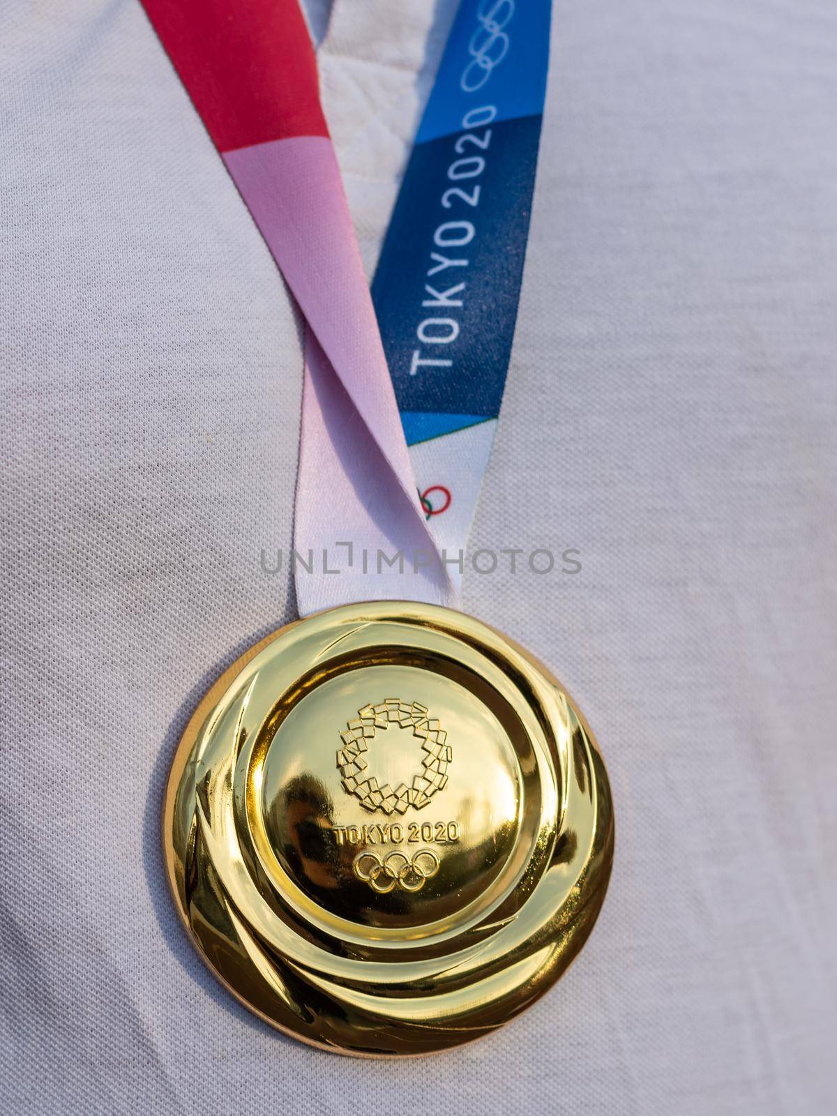 April 17, 2021 Tokyo, Japan. Gold medal of the XXXII Summer Olympic Games in Tokyo on the chest of the athlete.