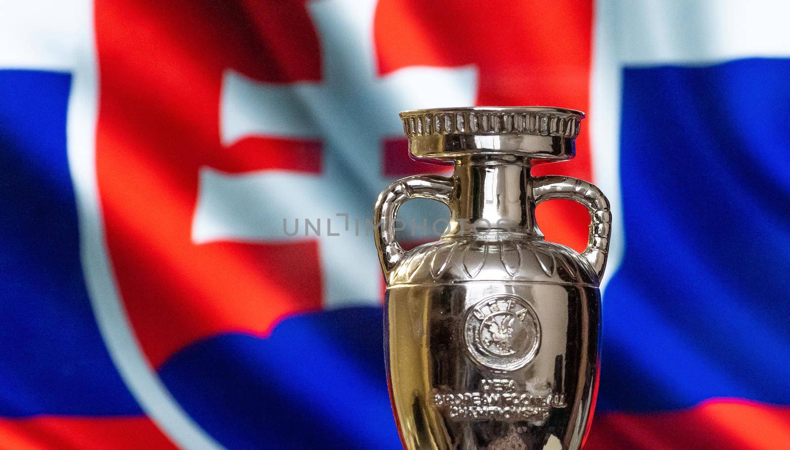 April 10, 2021. Bratislava, Slovakia. UEFA European Championship Cup with the Slovakian flag in the background.