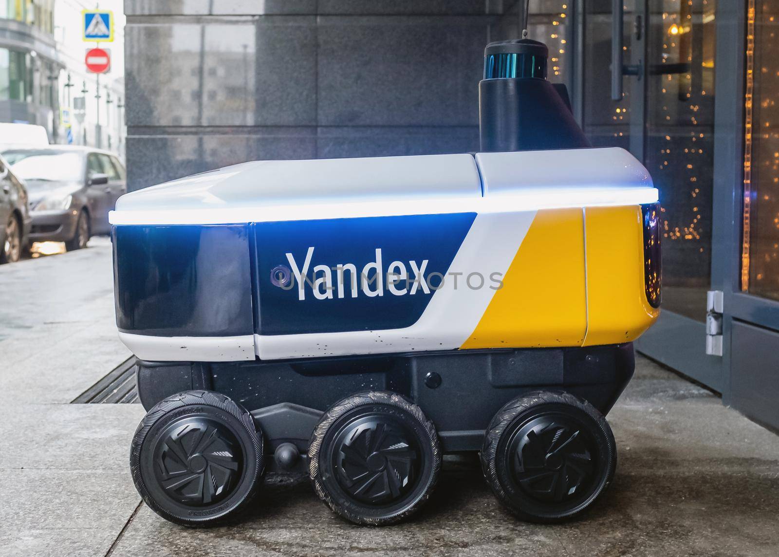 December 14, 2020, Moscow Russia. An unmanned robot courier for delivering food from the Yandex.Rover cafe at the entrance to a restaurant in Moscow.