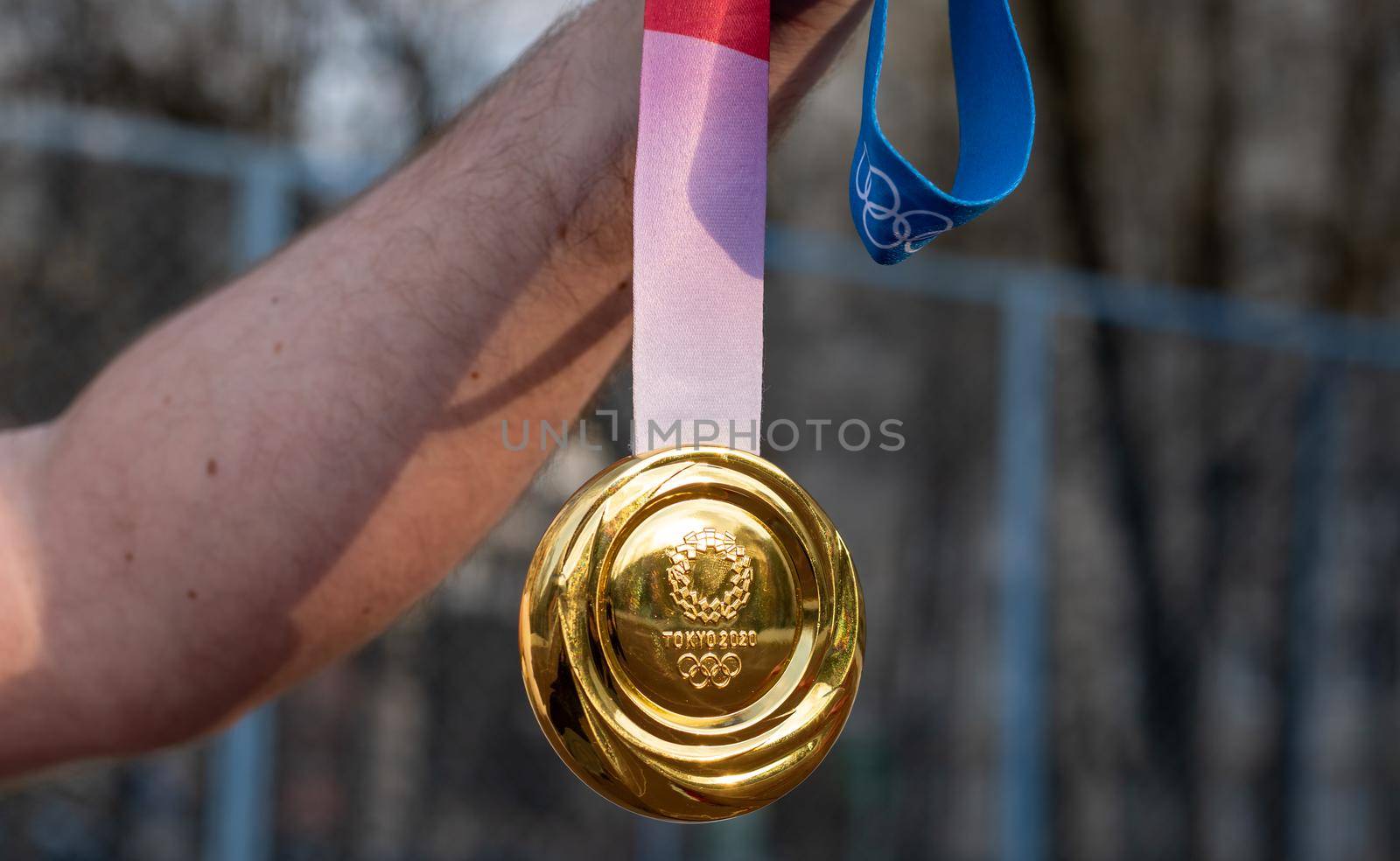 April 17, 2021 Tokyo, Japan. The gold medal of the XXXII Summer Olympic Games in Tokyo in the hand of an athlete.