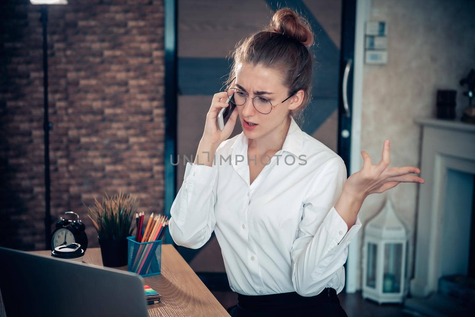 Business Entrepreneur Woman is Working on Table Desk While Calling on Mobile Phone for Own Business in Her Home Office, Businesswoman Worker Busy Work at Home During Covid-19 Pandemic.