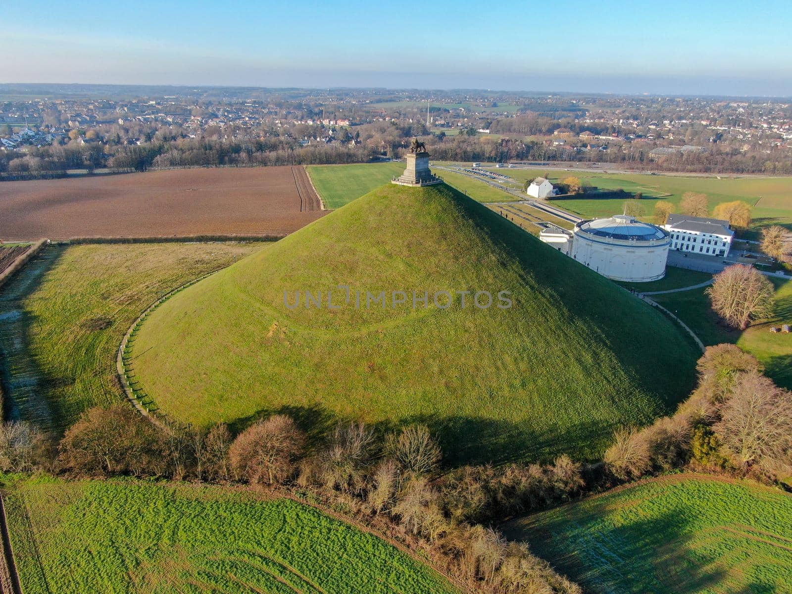 Aerial view of The Lion's Mound with farm land around. Waterloo, Belgium by Bonandbon