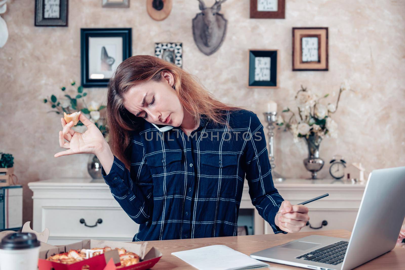 Busy Businesswoman Work at Home While Working on Table Desk With Laptop at The Same Time She Eating, Business Woman Entrepreneur Work From Home With Serious Communicating Busy Tasking. Work Lifestyles