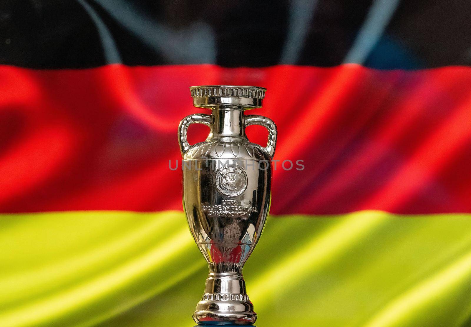 April 10, 2021. Munich, Germany. UEFA European Championship Cup with the German flag in the background.