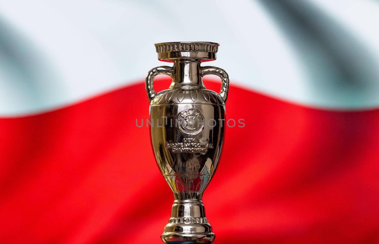 April 10, 2021. Warsaw, Poland. UEFA European Championship Cup against the background of the flag of Poland.
