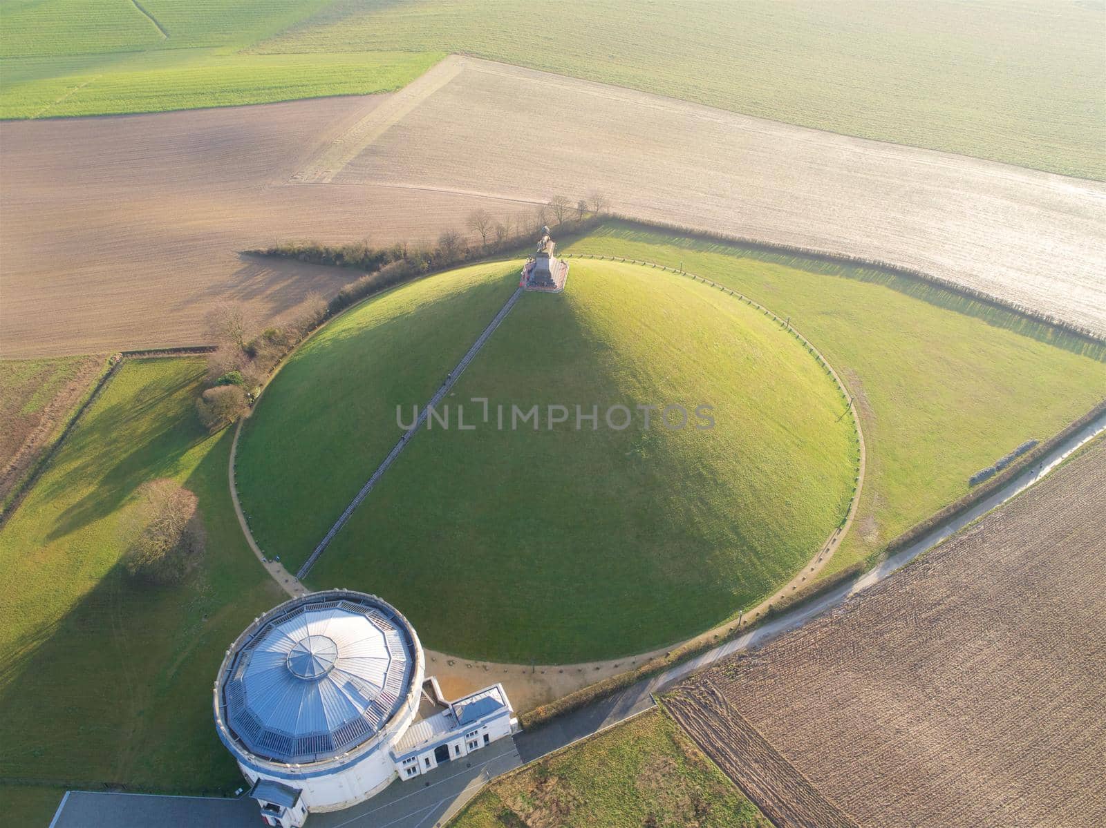 Aerial view of The Lion's Mound with farm land around. Waterloo, Belgium by Bonandbon