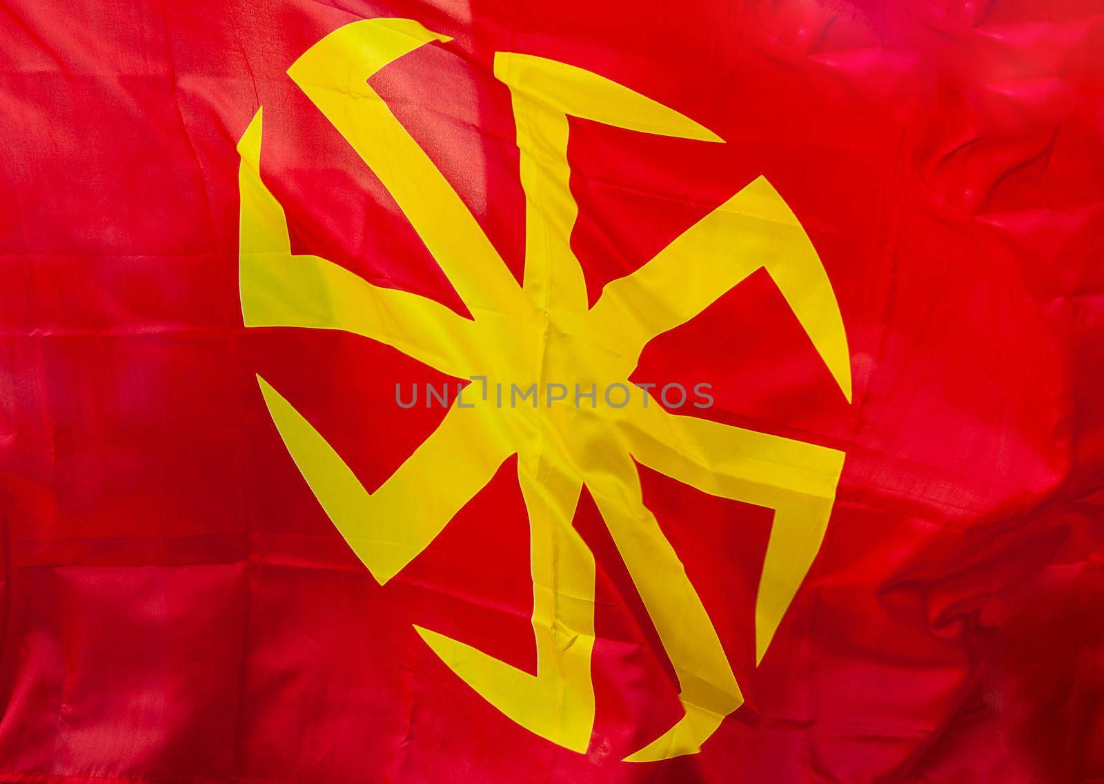 Yellow eight-pointed swastika - Kolovrat on a red background. by fifg