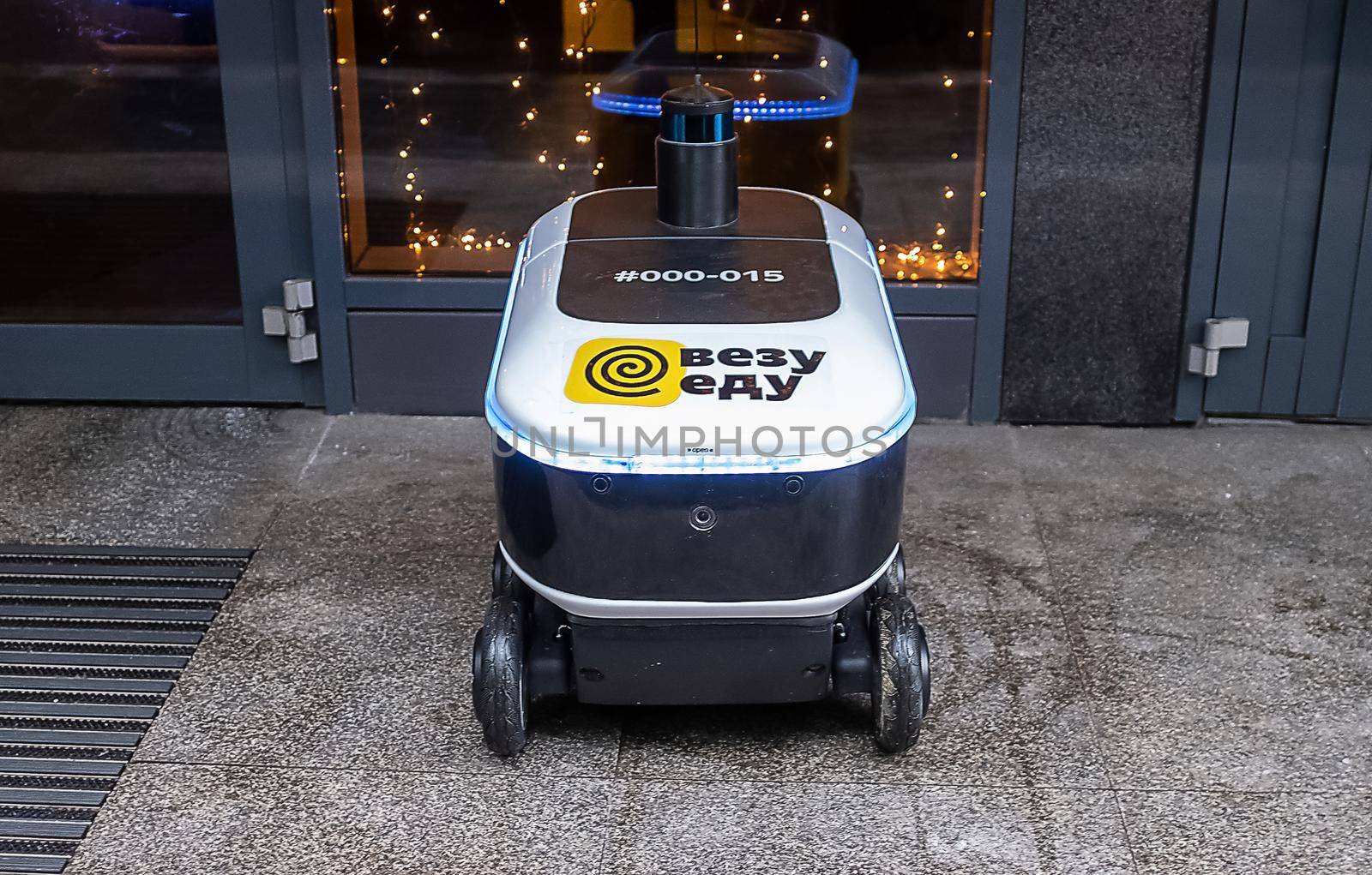 December 14, 2020, Moscow Russia. An unmanned robot courier for delivering food from the Yandex.Rover cafe at the entrance to a restaurant in Moscow.