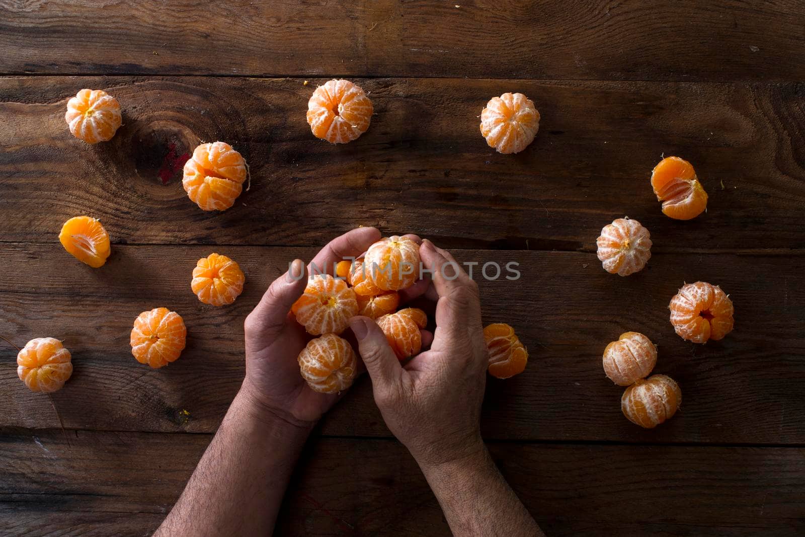 Presentation of Small peeled mandarin oranges on old wooden table