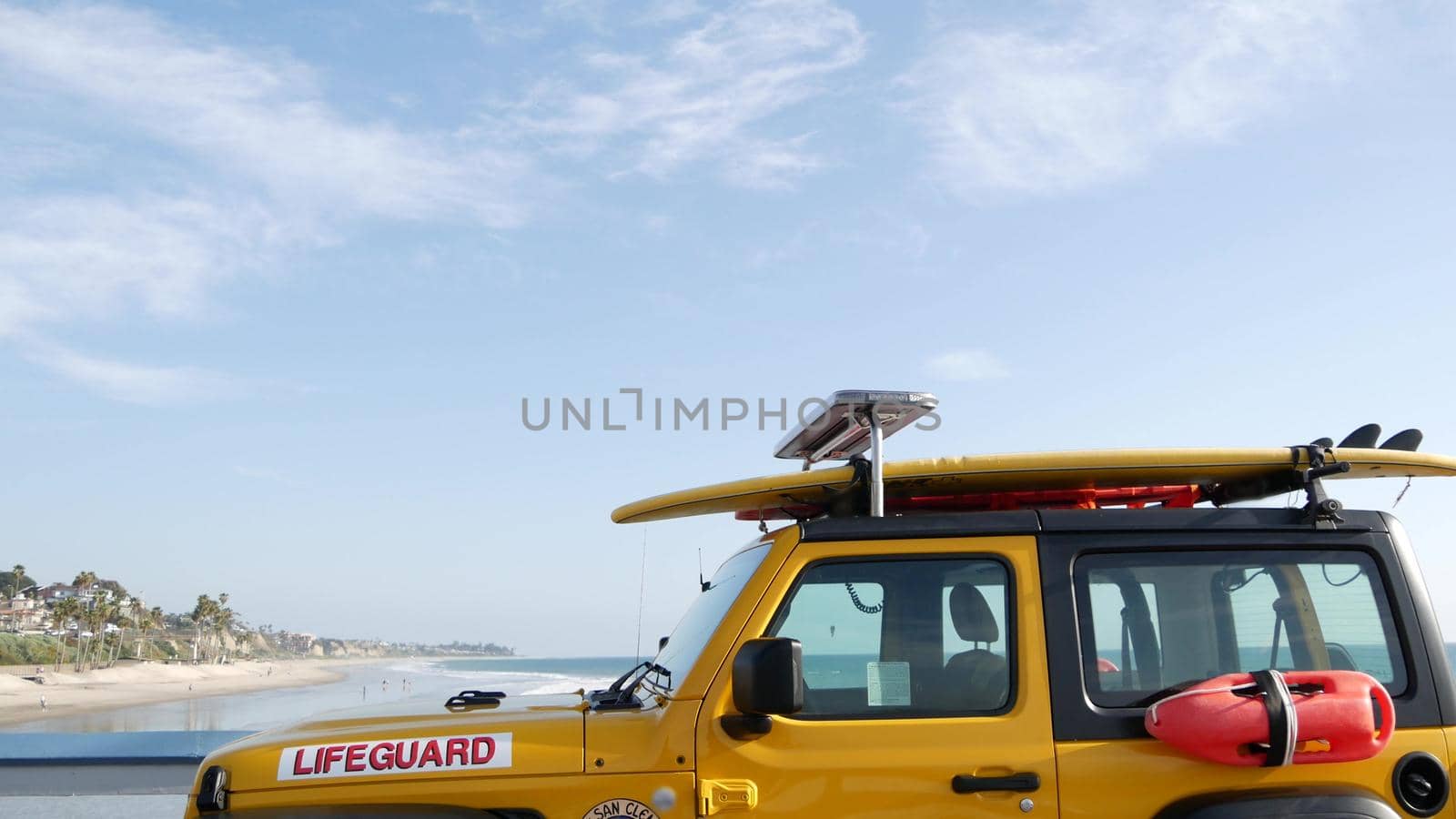 Yellow lifeguard car, ocean beach California USA. Rescue pick up truck, lifesavers vehicle. by DogoraSun