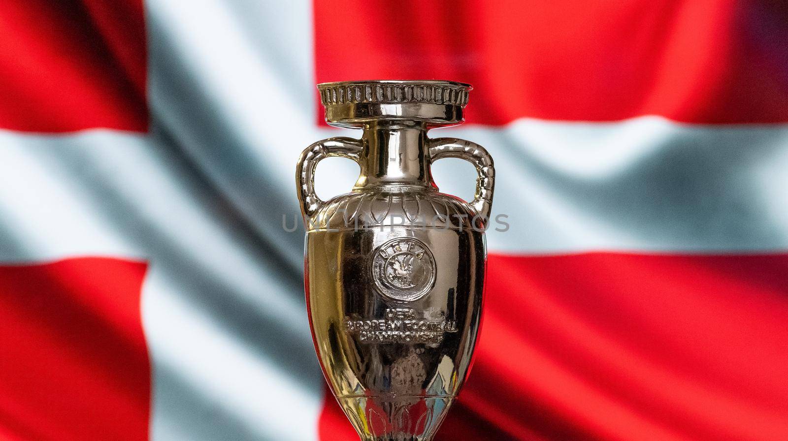 April 10, 2021. Copenhagen, Denmark. UEFA European Championship Cup with the Danish flag in the background.