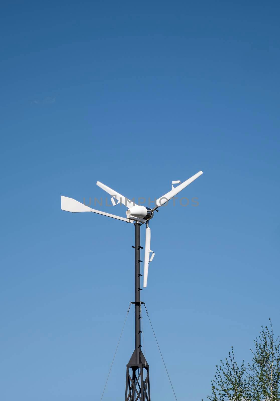 Windmill for renewable electric energy production in a private sector