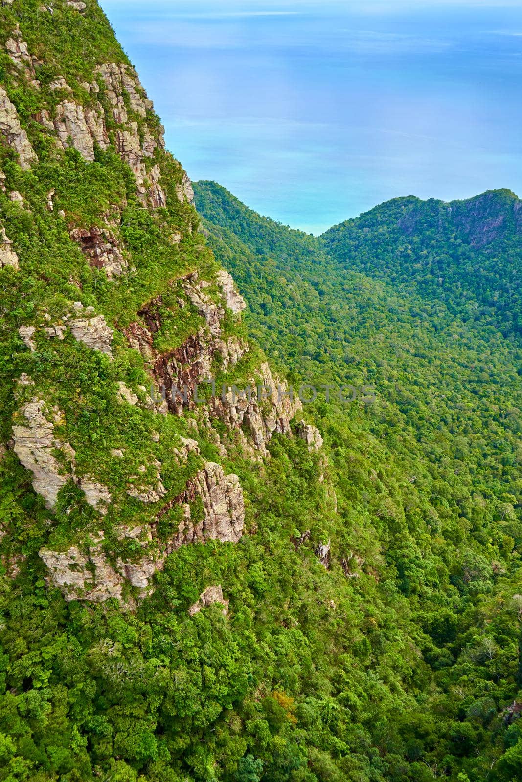 The incredible nature of a tropical island. Green mountains and perfect blue water. A heavenly place on earth.