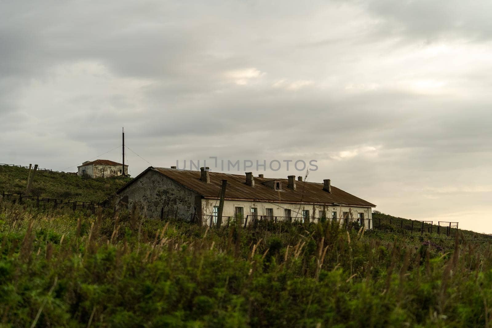 Landscape with old abandoned houses. Cape Pospelova, Primorsky Krai