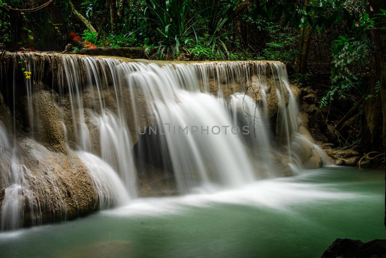 Huai Mae Khamin Waterfall at deep tropical rainforest in Srinakarin dam, national park in Thailand by domonite