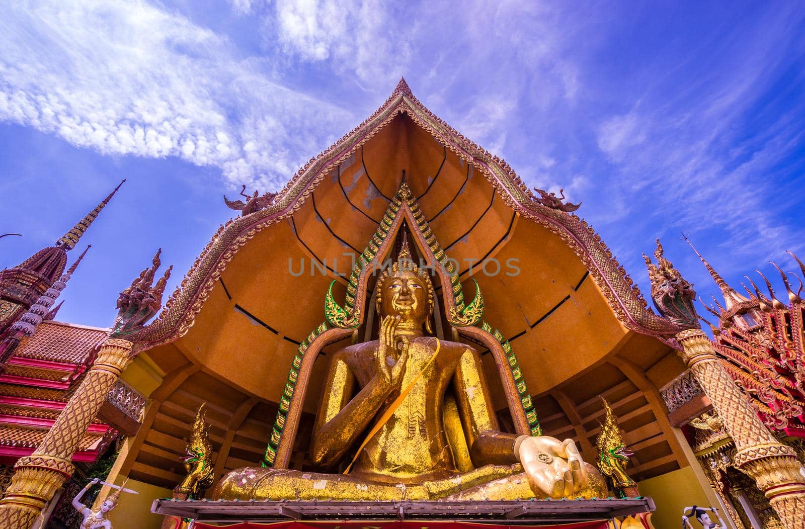 Big gold buddha statue and blue sky by domonite