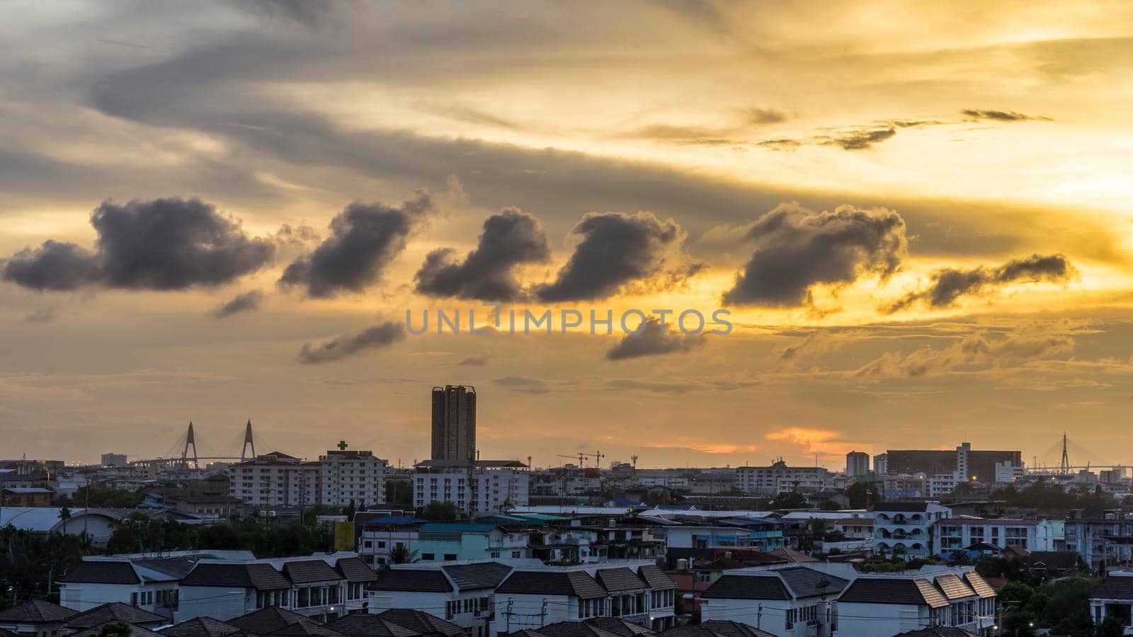 urban and cloudy sky in cityscape at evening time