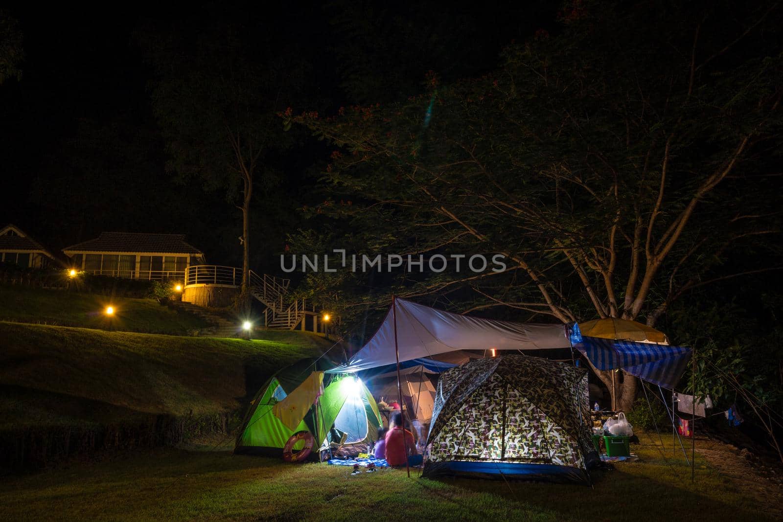 Camping and tent in the park at night