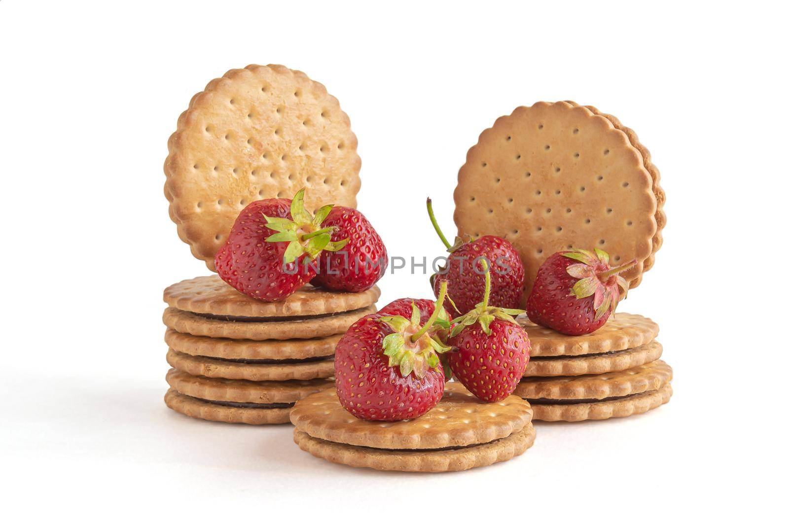 Cookies and berries of a ripe lover. Items isolated on white background. Stock photography.