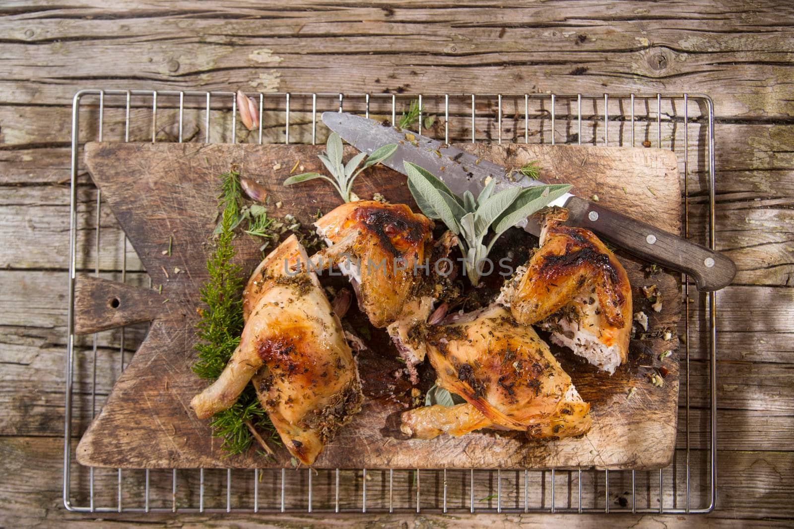 Presentation of a marinated chicken with herbs and baked in the oven