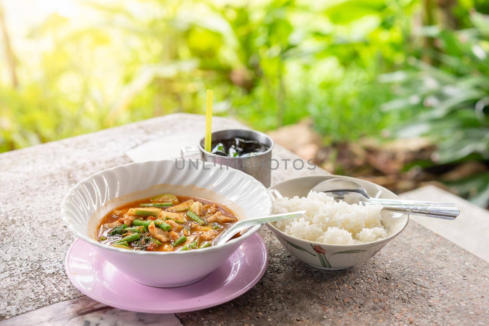 sour fish balls soup with long bean and cooked rice on table, Thai Food