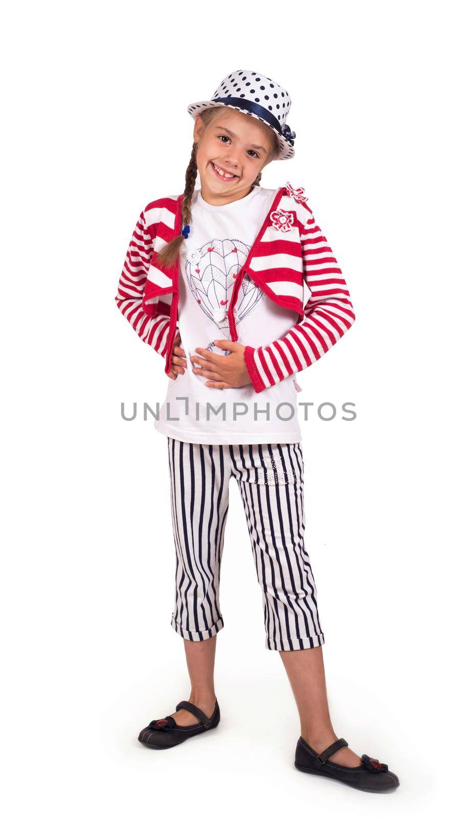 portrait of a girl in striped trousers and a hat