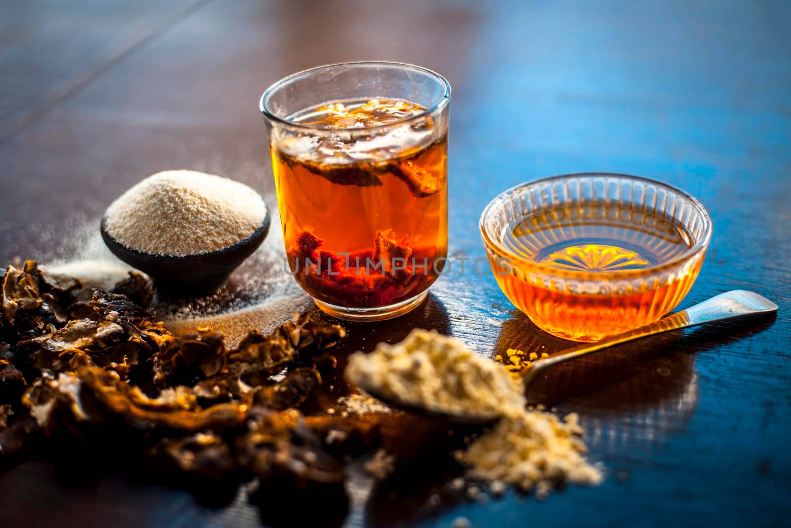 Best home remedy to treat acne and pimple on wooden surface i.e. Tamarind pulp,semolina and gram flour along with honey,On wooden surface in vintage containers.