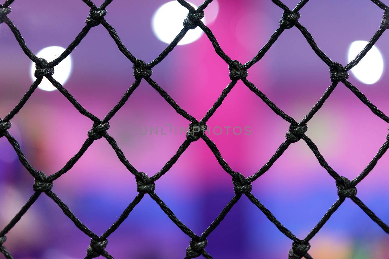 Rope mesh with blurry background in children playground by domonite