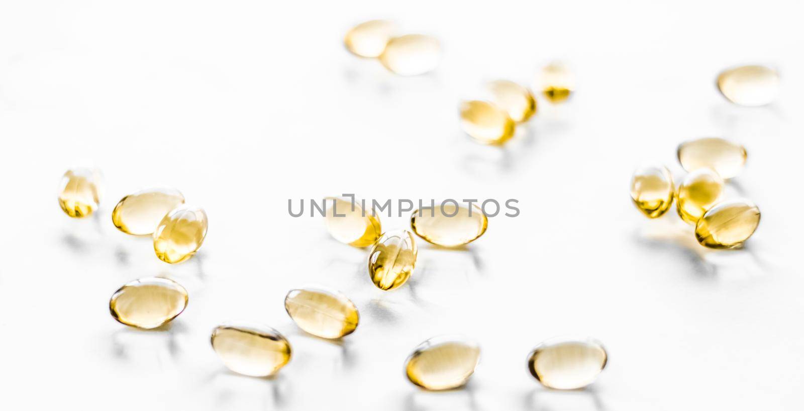 Pharmaceutical, branding and science concept - Vitamin D and golden Omega 3 pills for healthy diet nutrition, fish oil food supplement pill capsules, healthcare and medicine as pharmacy background