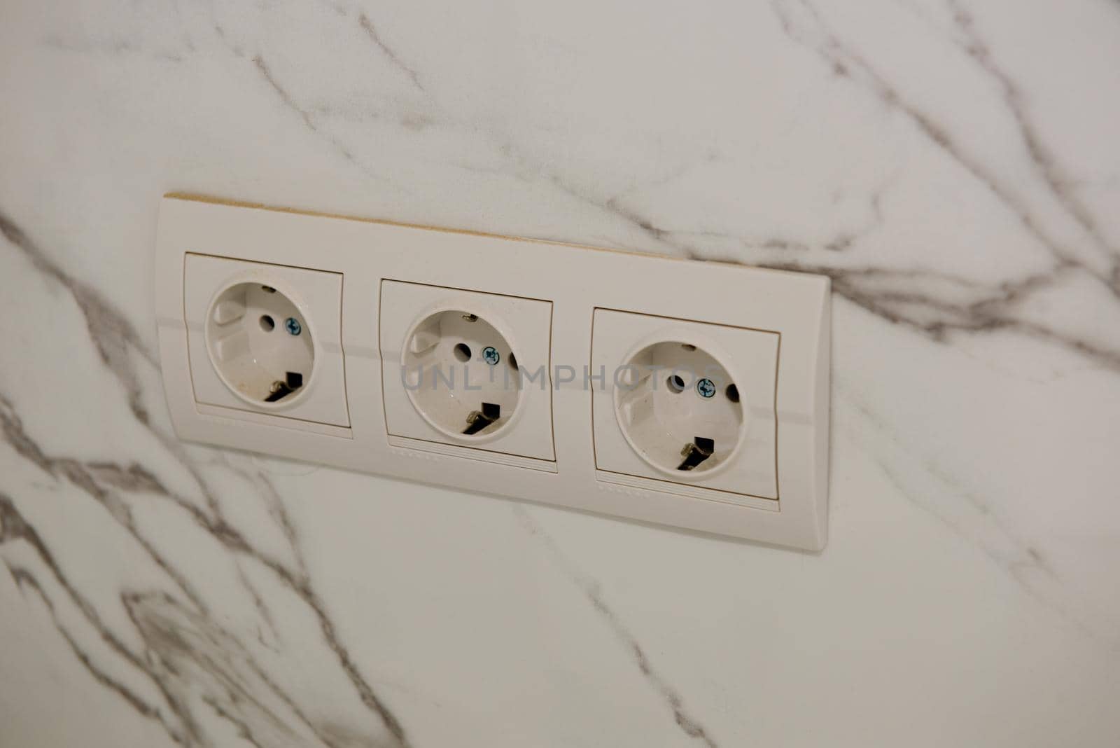 New socket installed on the tile. Close up. by leonik