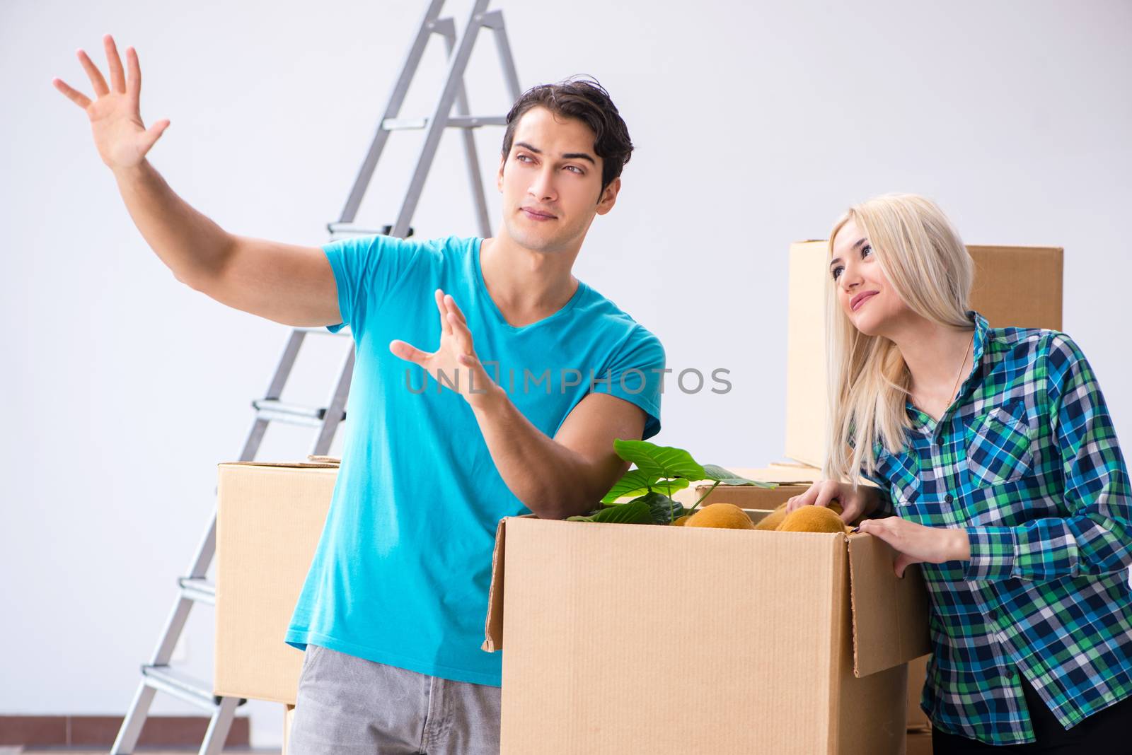 Young family moving in to new apartment