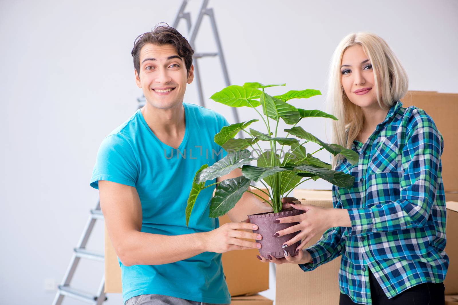 Young family moving in to new apartment