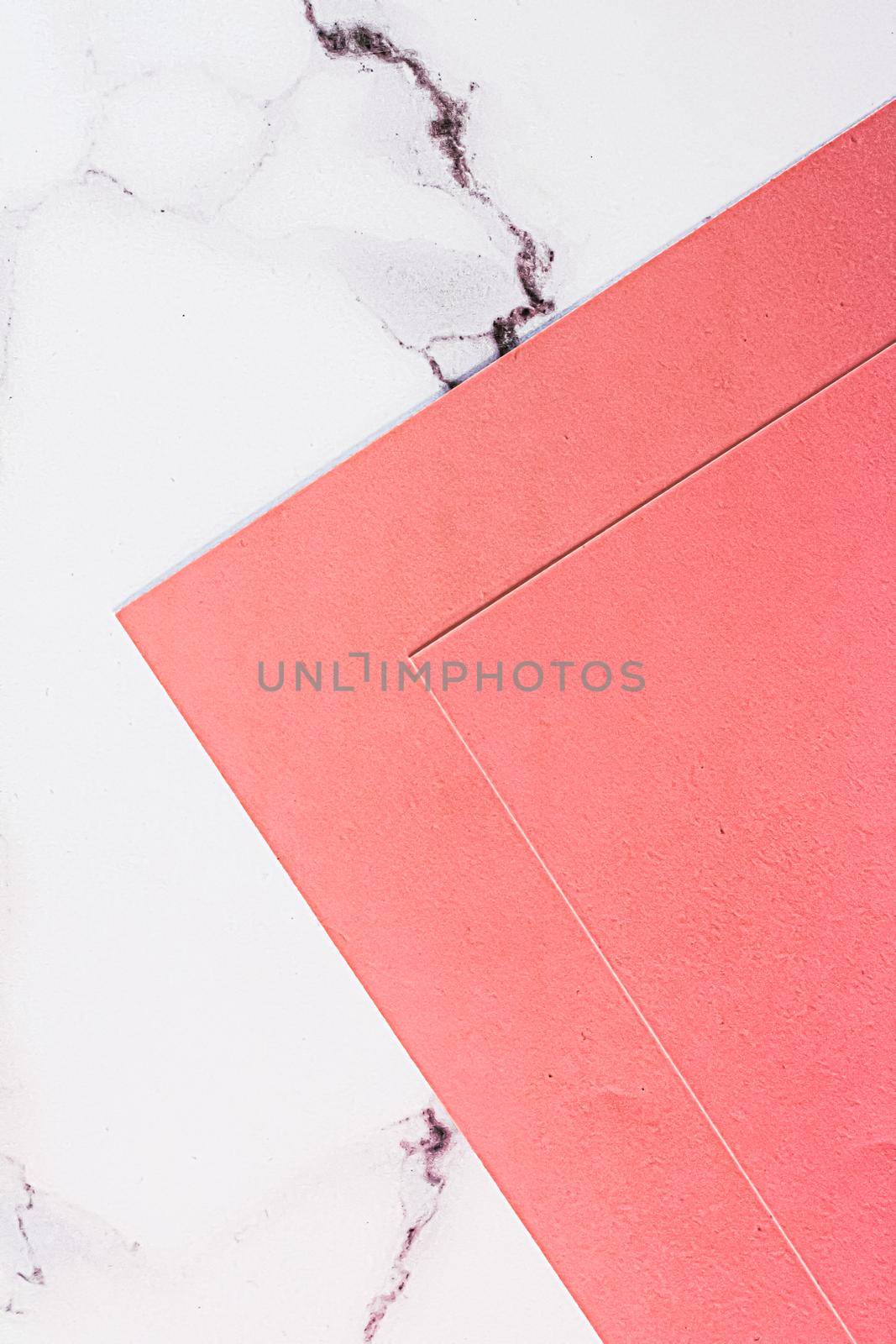 Pink A4 papers on white marble background as office stationery flatlay, luxury branding flat lay and brand identity design for mockups