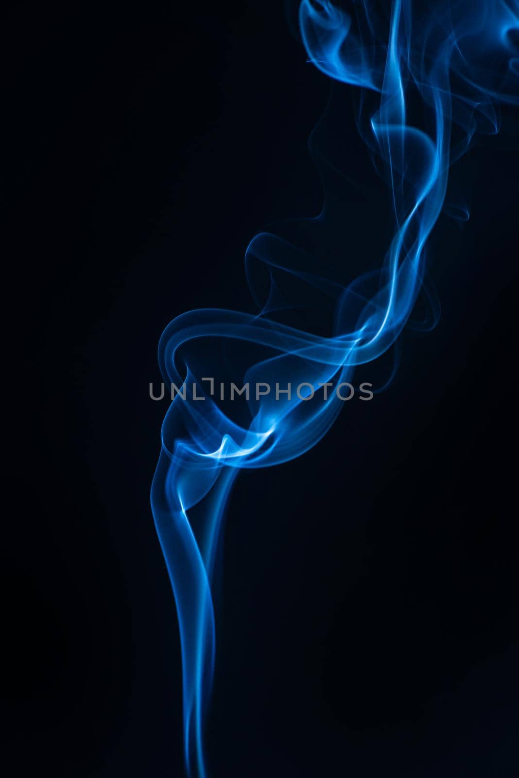 Blue smoke isolated on black background.