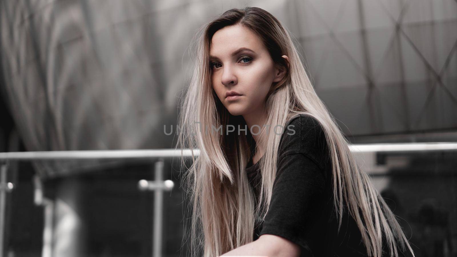 Urban style blonde girl with a stern look. Girl power and subculture concept. by natali_brill