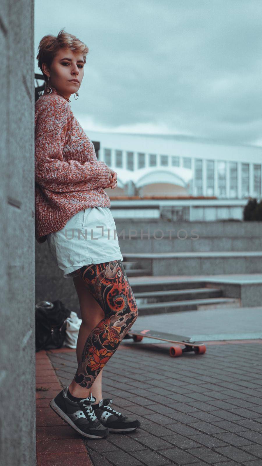 Beautiful young girl with tattoos with longboard by natali_brill