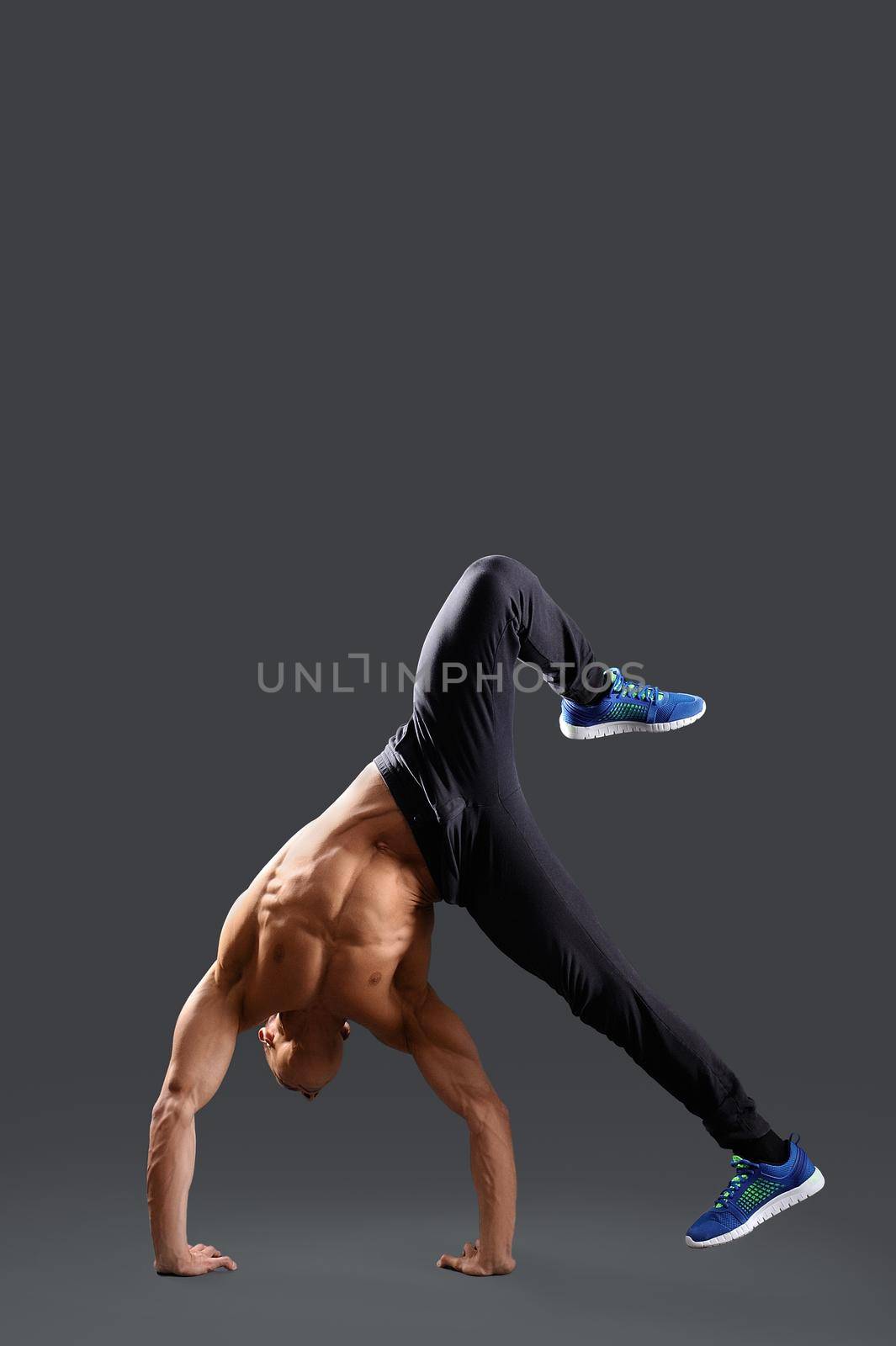 Professional fitness man in studio by SerhiiBobyk