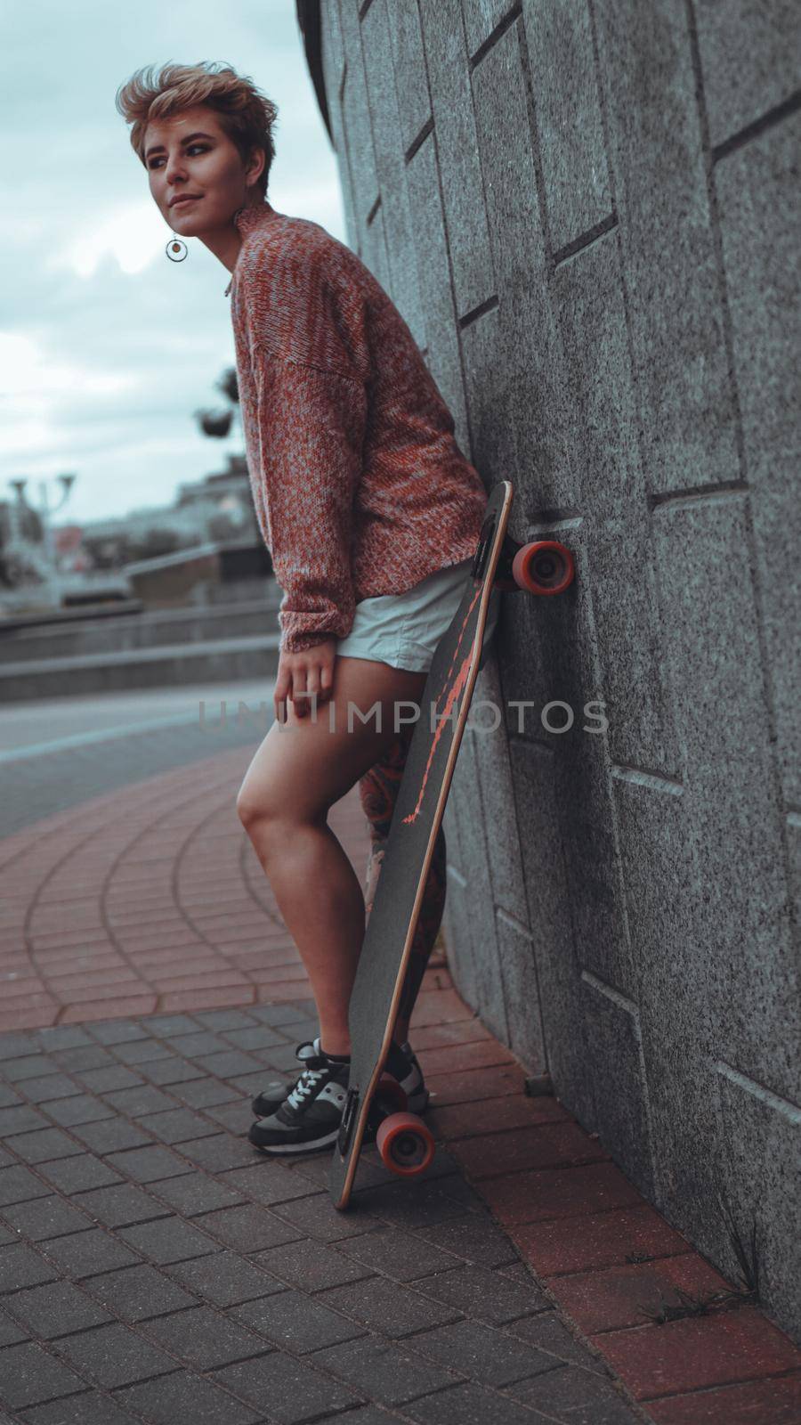 Beautiful young girl with tattoos with longboard by natali_brill